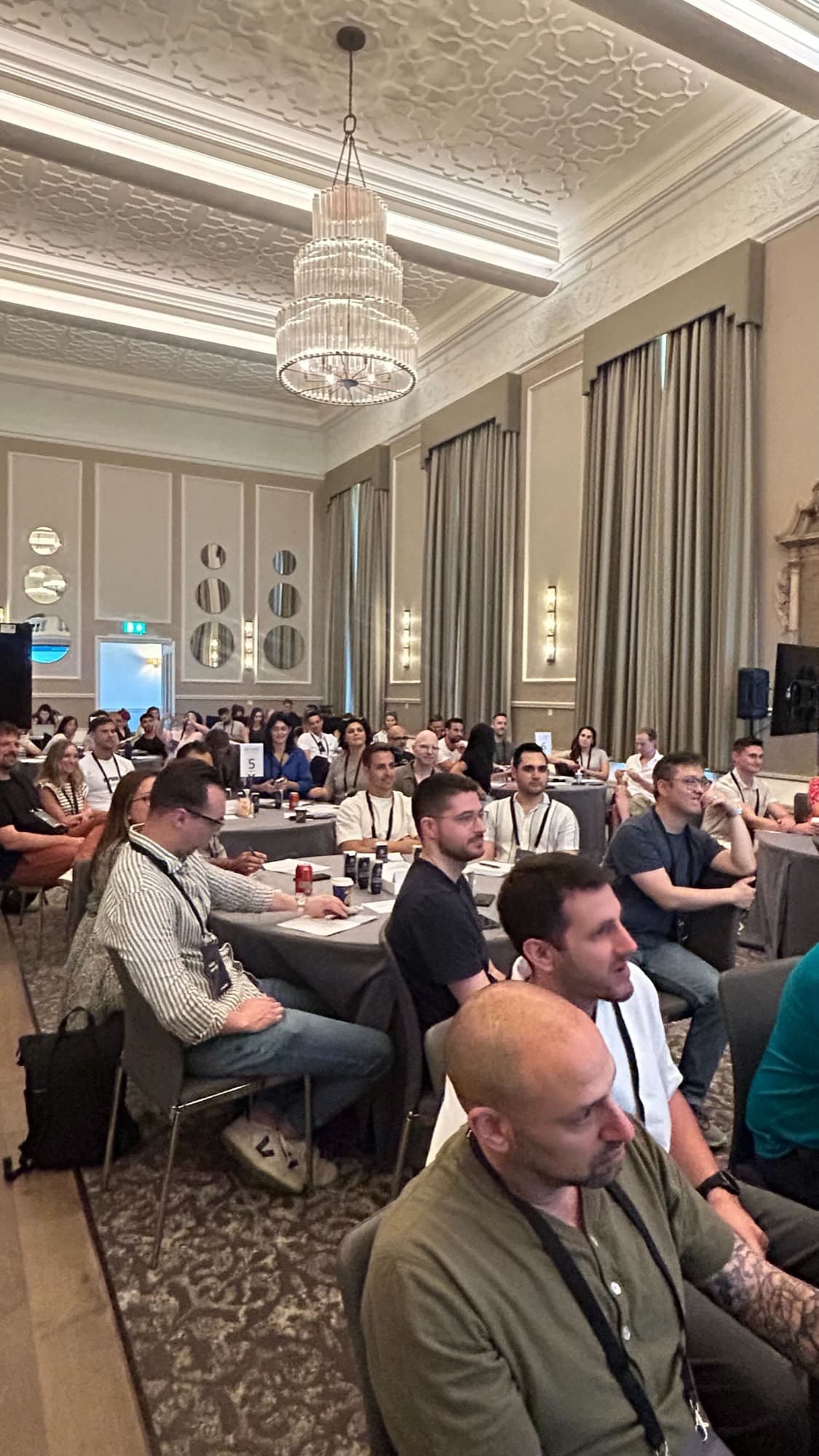 An audience listening in a ballroom